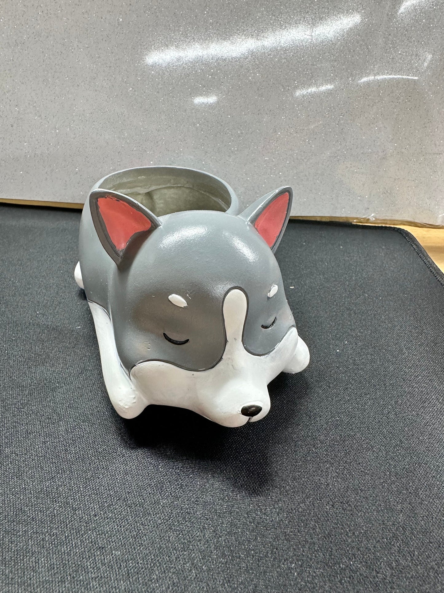 Conrad Corgie, Bud bulldog, Sally schnauzer, Peggy pug, and Henry husky planters